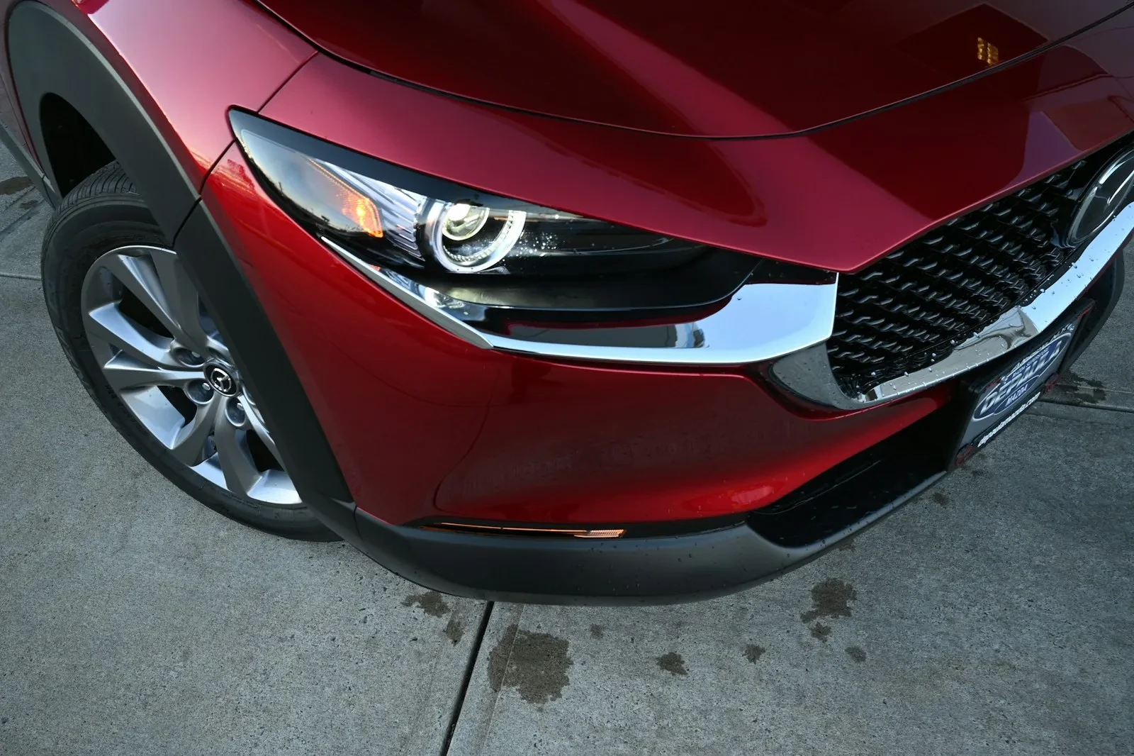 a close up of the front of a red car