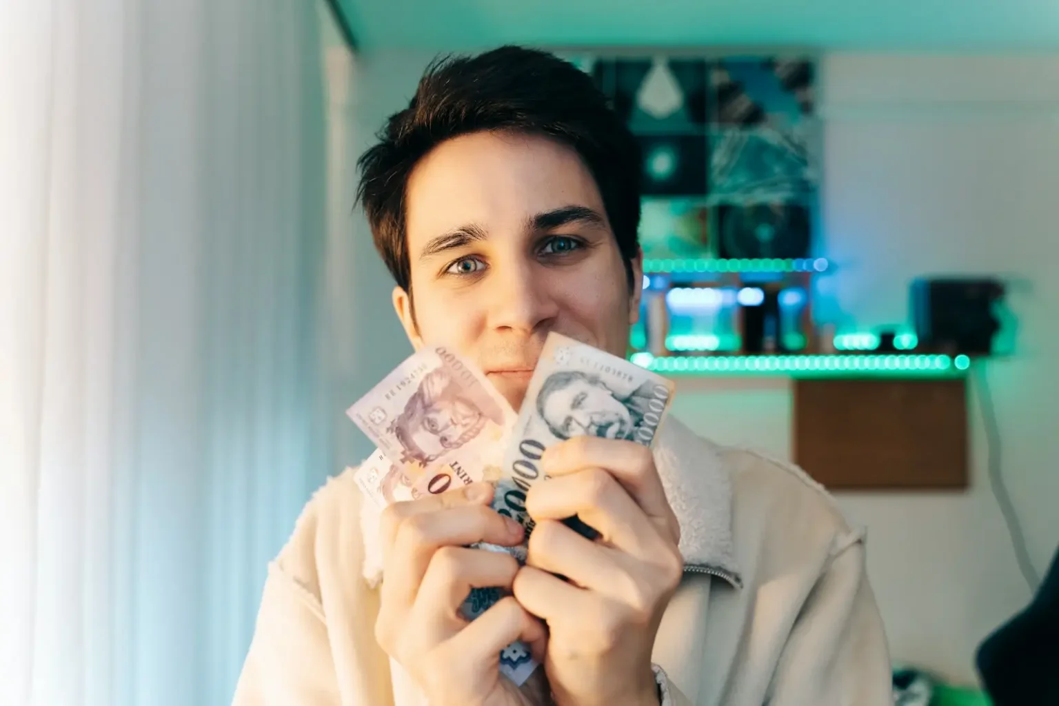 a woman holding a bunch of money in her hands